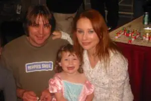 Tori with her husband, Mark Hawley, and a toddler Natasha