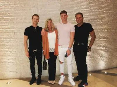A family picture of Juliette Porter's New Boyfriend, Sam Logan (dressed in white) with his parents and brother
