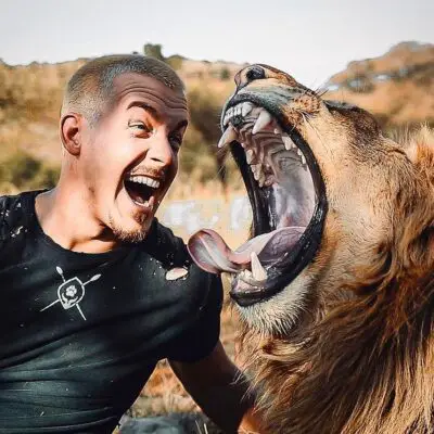 Dean Schneider with a Lion Photo