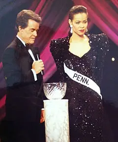 A photo of Johnson in a beauty pageant with Dick Clark in 2011