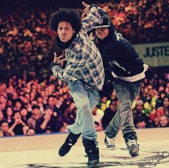 A photo of Larry Bourgeois dancing opposite his twin brother Laurent
