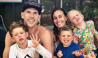 A photo of Bryan Wolfe his wife Kim and children